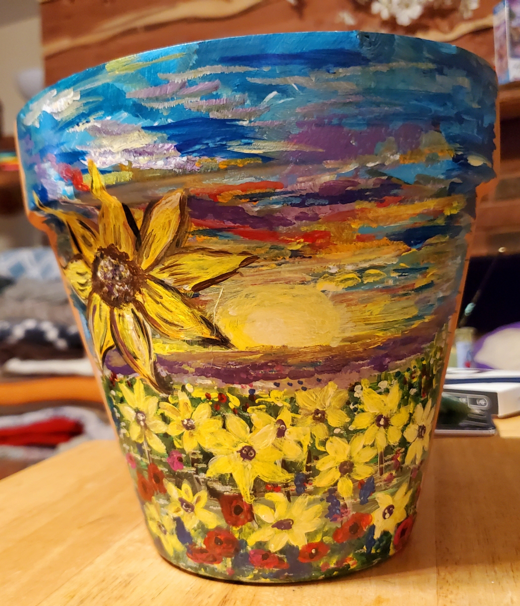 sunflower landscape painted on a terra cotta flower pot by Karen Arthur