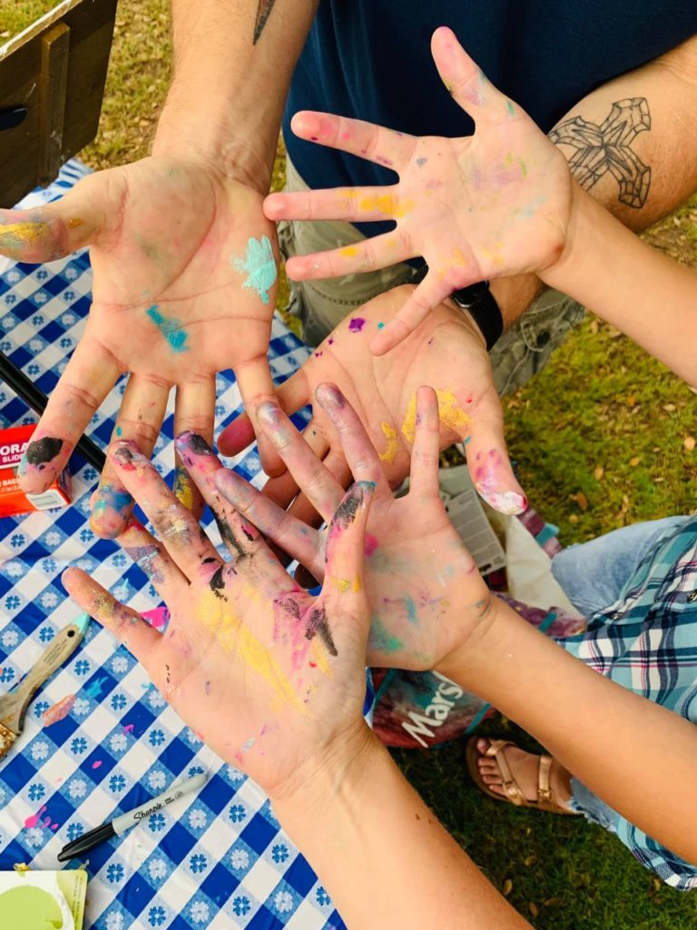 Kids with messy hands after painting